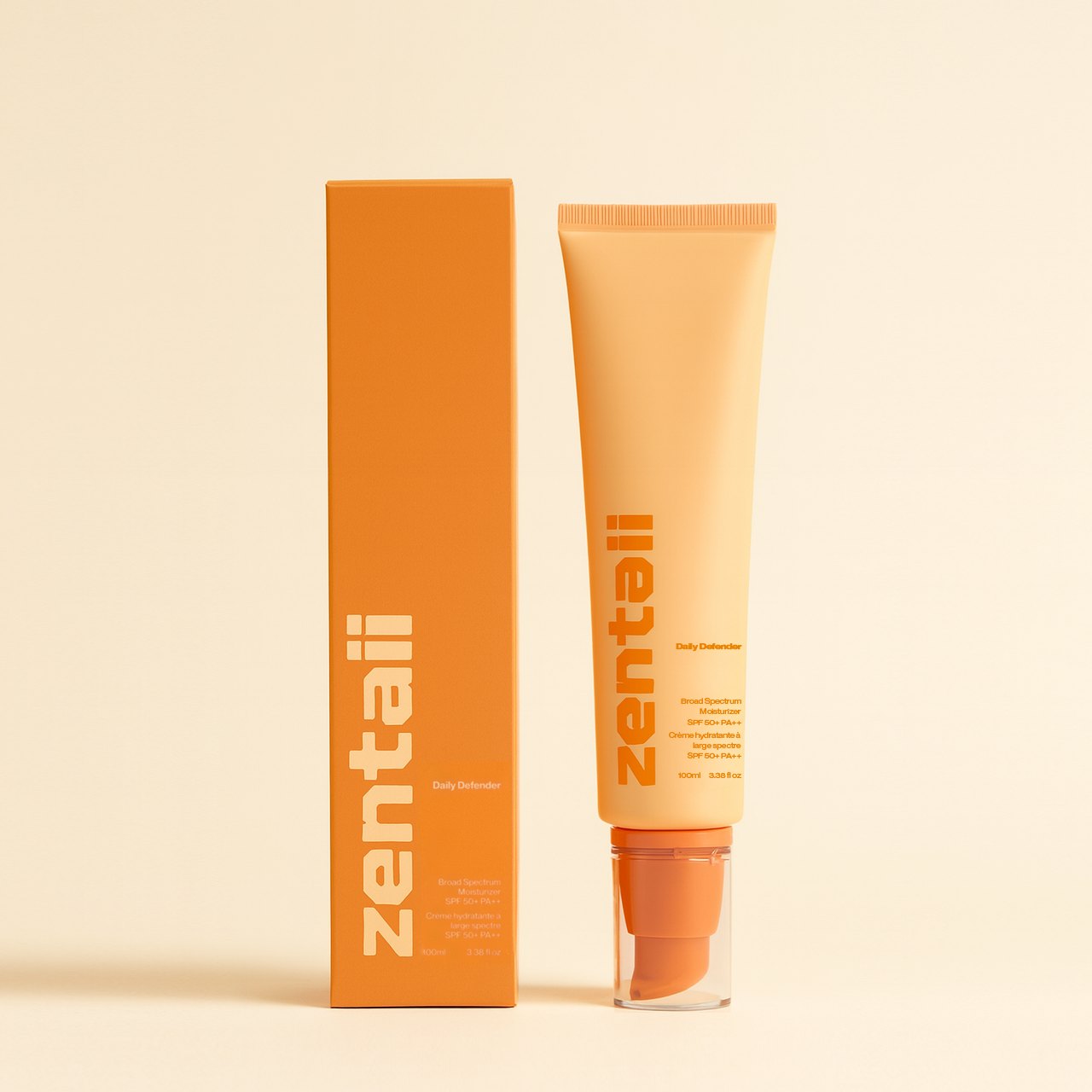 The orange Daily Defender carton beside its matching SPF tube.
